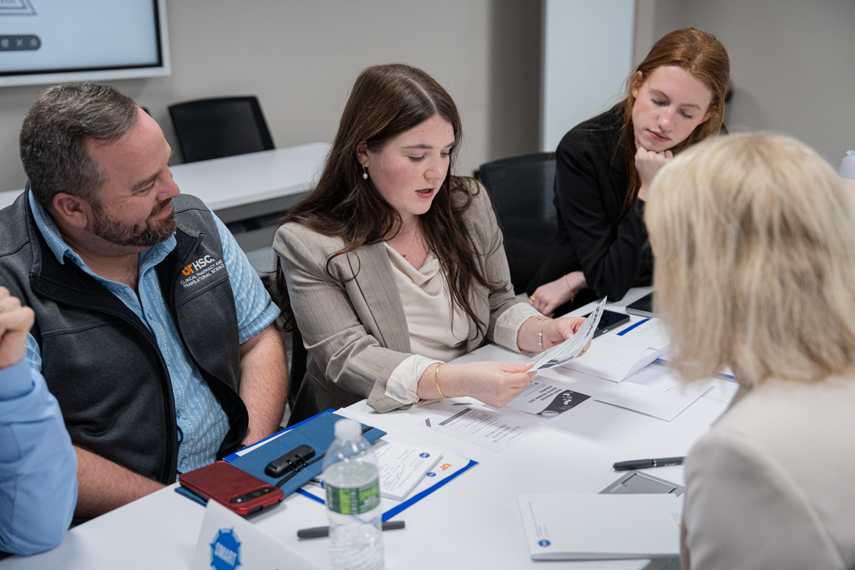 The SMART Initiative advisory council meets in a small group to go over an activity.