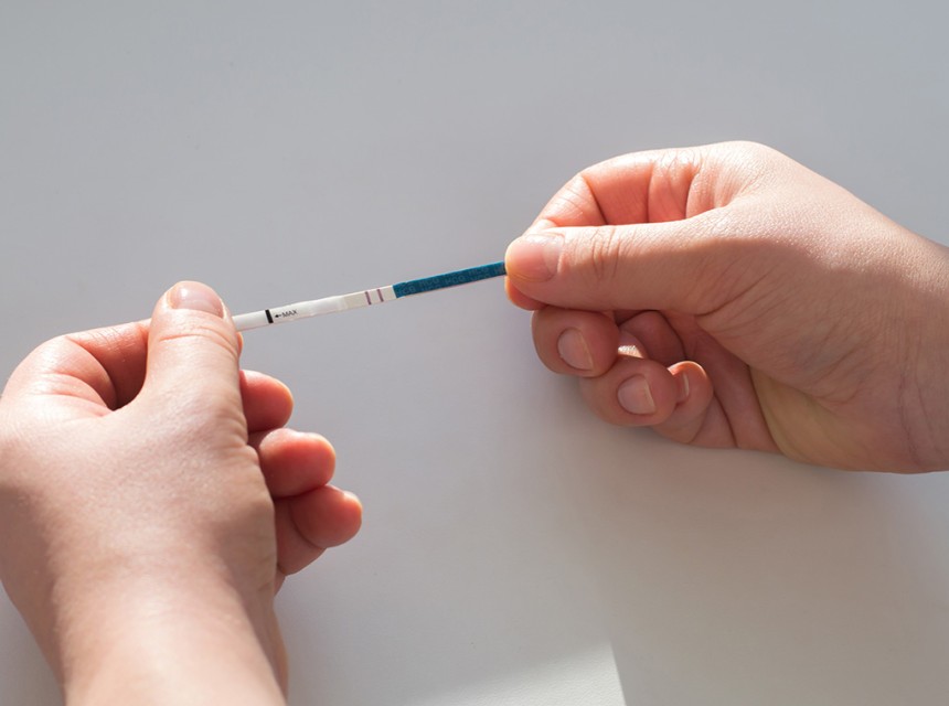 A person holds a Fentanyl test strip.